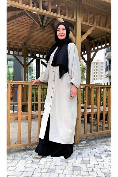 تونيك محتشم بأكمام الخفاش وتفاصيل أحجار